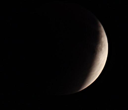 A telephoto (300mm) of white crescent of Moon before the full eclipse
