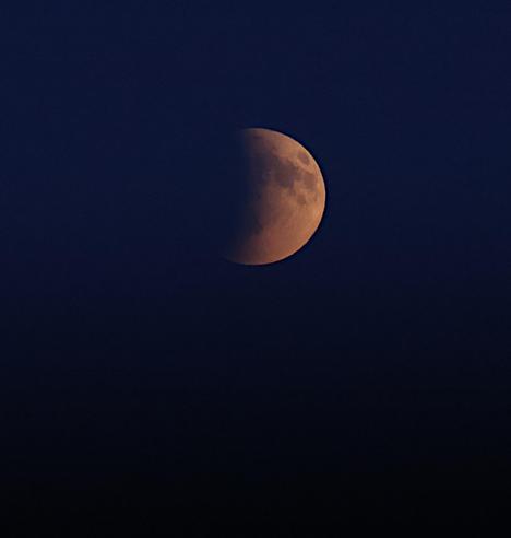 A telephoto (300mm) of shaded Moon (the right half is still visible) before the full eclipse.