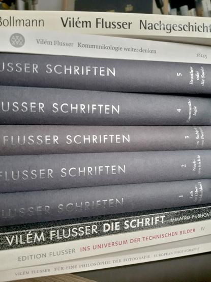 A pile of ten books in German by Vilem Flusser.