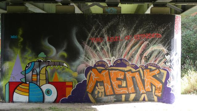 "This level of retarded". Street art , graffiti under a bridge over the River Avon at the town of Chippenham, Wiltshire, England. September 2025