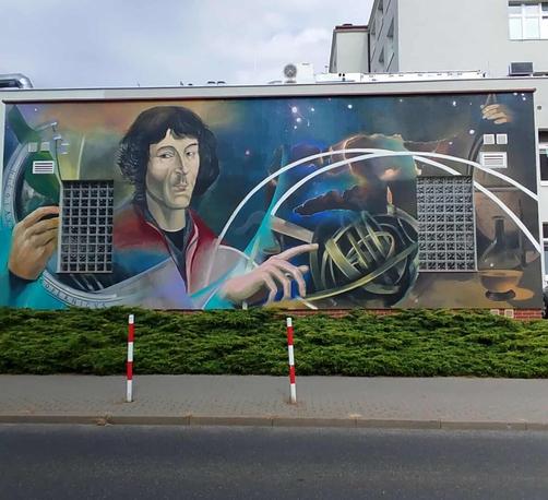 Mural by Jakub Brodzik in Toruń (Poland) dedicated to Nicolaus Copernicus, a Polish astronomer, who formulated a model of the universe that placed the Sun rather than Earth at its center