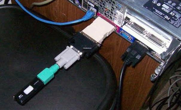 A USB stick connected to a computer using 4 adapters.