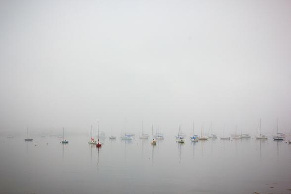 sailboats at anchor on a foggy morning in maine 13 years ago