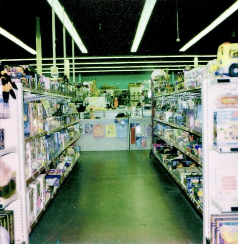 The interior of Sir Troy's Toy Kingdom, looking towards the central counter.
