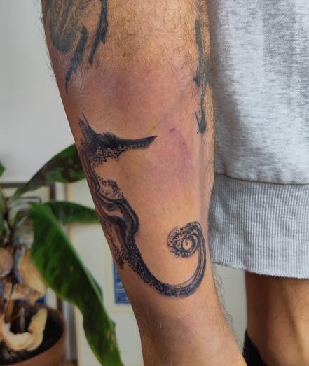 Seahorse tattoo on a lower leg