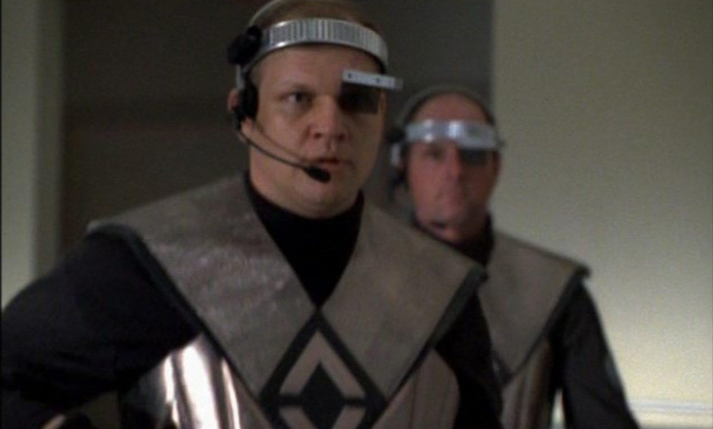 Your local Mastodon instance moderation team springs into action to determine if calling someone 'braindead as systemd' counts as a slur. Two men dressed in futuristic armour with visors, headsets and very serious expressions arrive.