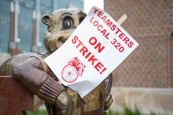 A Teamsters strike sign rests in the arm of a statue of Goldy the Gopher on the University of Minnesota campus on Wednesday. The school and its workers reached a deal this weekend. (Alex Kormann/The Minnesota Star Tribune)