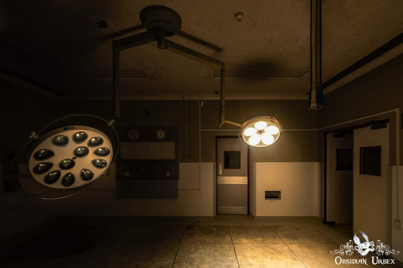 dark operating theater with operating light turned on