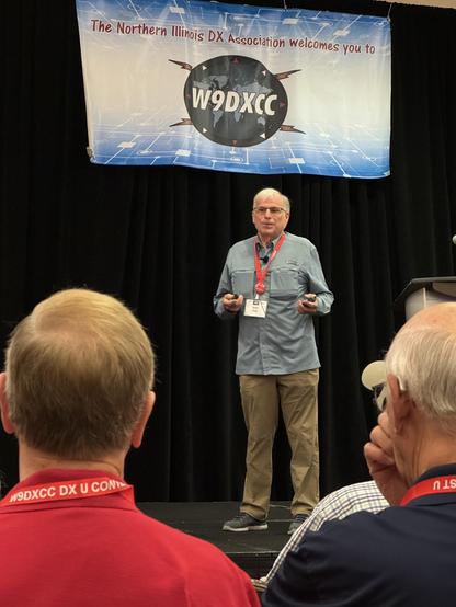 gene speaking on the stage at W9DXCC