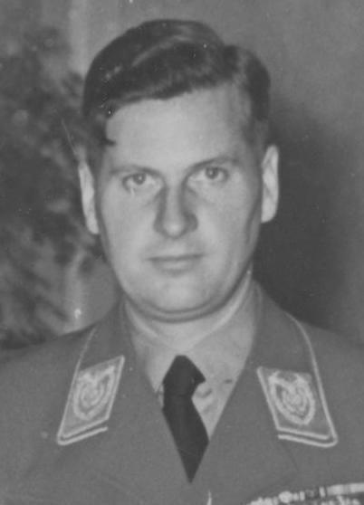 A picture of the leader of Hitler youth in his uniform. It is black and white.