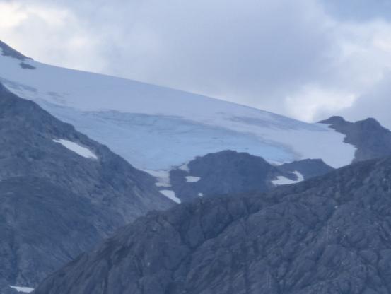 Glacier with white ice sheet and a blue area.