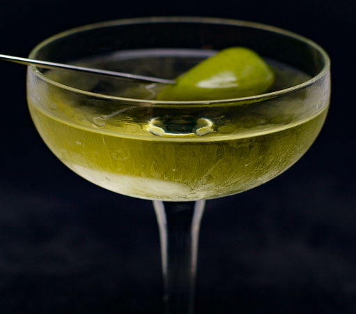 The cocktail itself in a chilled coupe and garnish with an olive