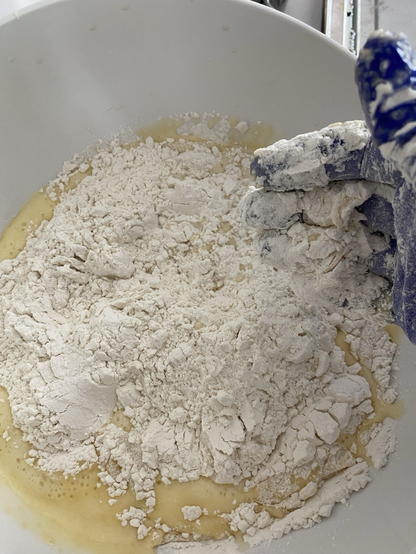 Mixing the yeasty, fatty, egg water with the flour and salt