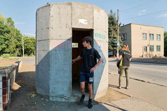 Residents hide in a bunker during an attack by Russian invading forces using missiles, cluster bombs, and Shahed drones in summer of 2025 in Kramatorsk
