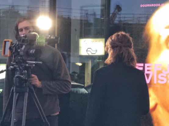 A cameraman and an anchorwoman.