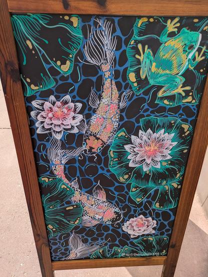 Chalk drawing of koi, frog  and lilypads