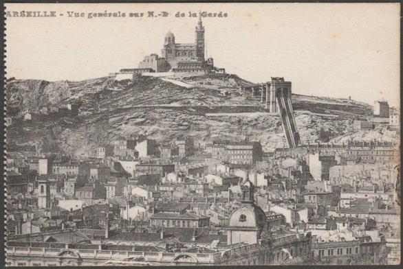 Printed monochrome postcard showing a view of Marseille in France, looking up to Notre-Dame de la Garde and the funicular railway.

Publisher not stated, not numbered, c.1910s.

Postally unused.

Very good condition, with very slight corner bumps.