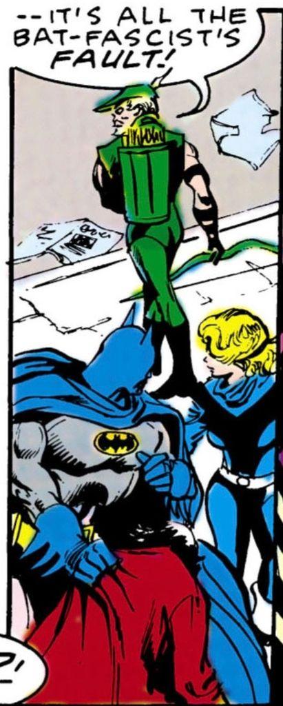 Batman is holding up what appears to be a slumped over unconscious man in one hand while he turns around in unison with 1980s era Black Canary as they both watch Green Arrow walk on the sidewalk towards the street in discust saying, “– – It’s all the bat-fascist’s FAULT!“