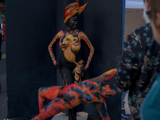Painted models posing for their art display