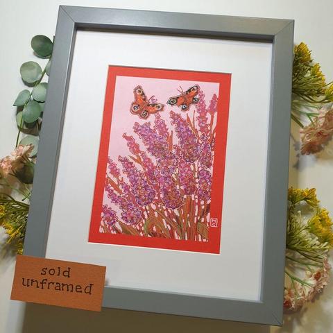 A small original artwork of two peacock butterflies flying over purple and pink toned Buddleia bush flowers. The artwork has a pink background and is on red paper.
An original art work
Colour pencil and mixed media on acid free toned artist paper
5 by 7 inches (12.7 by 17.8 cm).
Sold unframed