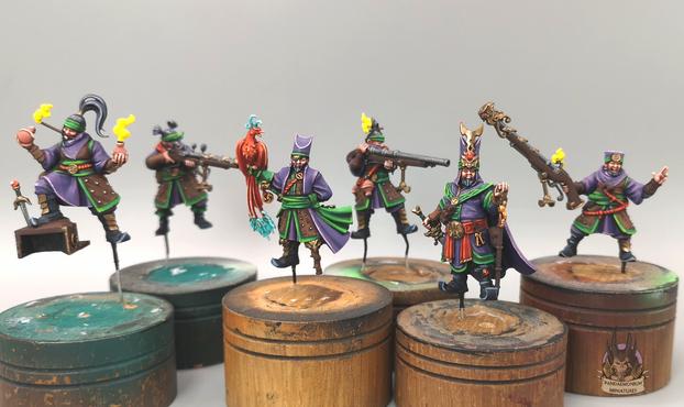 work in progress on the six crew members (including the Magistrate)
A mainly purple and green scheme with red as a spot colour (front view)