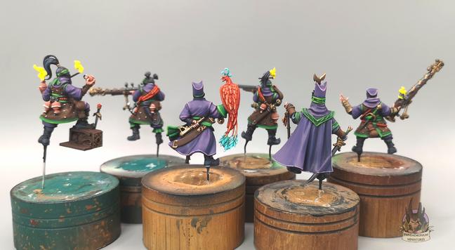 work in progress on the six crew members (including the Magistrate)
A mainly purple and green scheme with red as a spot colour (back view)