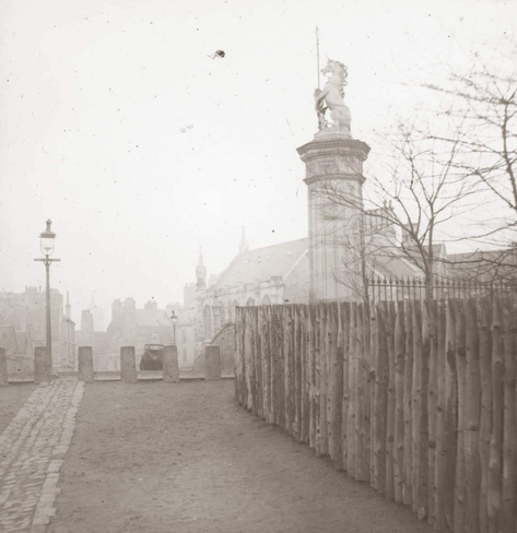 Middle Meadow Walk, Forrest Road entrance showing one of the pair of entrance pillars and the stone bollards. Photograph by Thomas Begbie, Glass negative. © Edinburgh City Libraries
