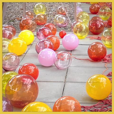 Festive thoughts are like these colorful glassbowls, red, yellow, orange.