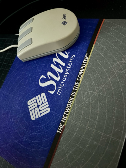 SUN Type 5 mechanical mouse on a promotional SUN Mousepad