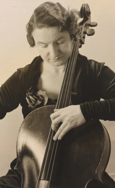 Marie Roemaet Rosanoff, a white woman with short dark hair, playing a cello