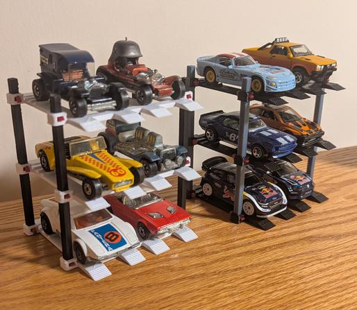 Two three-level car lifts with six diecast cars on each one.
