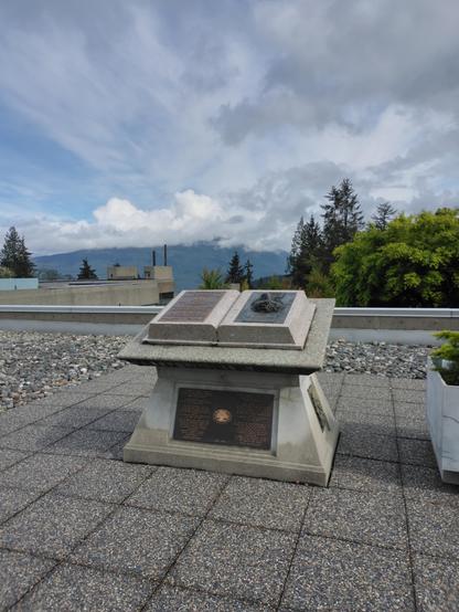 Memorial to Khalil Gibran at SFU with mountains in background