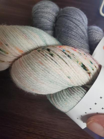 Close up of cream speckled, gray behind