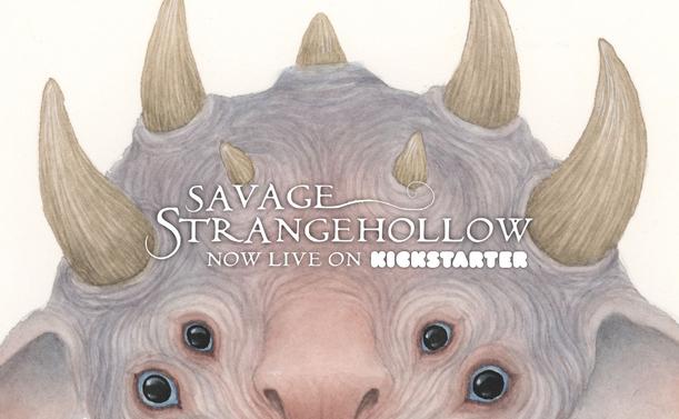 the top of a creature's head with lots of horns. It also has four black eyes with blue sclera and a pink nose. the text says 'savage strangehollow, now live on kickstarter'