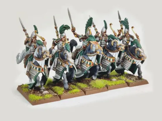 A unit of five Ellyrian Reavers from Warhammer Fantasy Battle/The Old World. They are painted in a mixture of green and white, carrying bows and spears and riding grey horses.