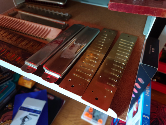 The shield and reed plates drying on my shelf having been rinsed of brass burs and sawdust