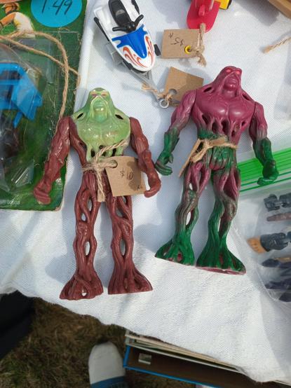 two small rubber Swamp Thing figurines.