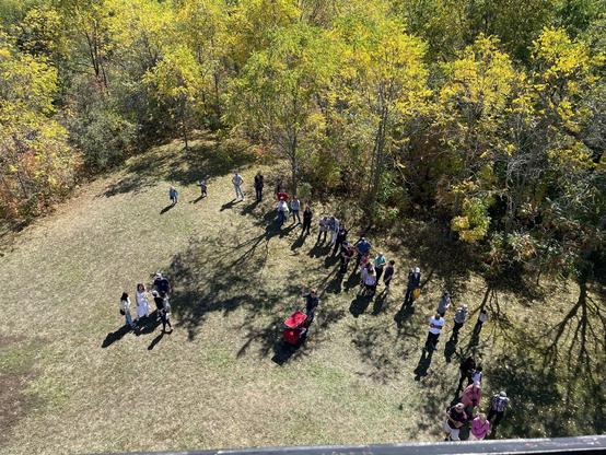 View of people lining up to go into Pioneer Tower, from the top of the tower.