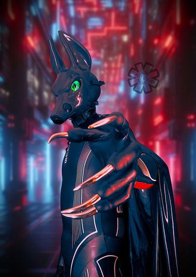 A dark rubbery Anubis figure stands before you, his arm outstretched as if trying to grab you. He is wearing his Huub Albacore wetsuit and his latex cape. His shiny body and claws glisten beneath the bright red and blue lights. His bright green eye glows as he gazes towards you, a stark contrast to the surroundings.