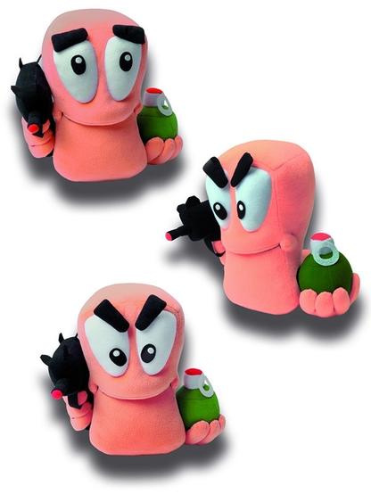 3 photos of a Worms plushie holding an uzi and a grenade, showing that the eyebrows and pupils are detachable