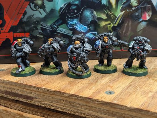 Five firstborn-era Deathwatch Space Marines. Painted to an okay level and in need of some attention.