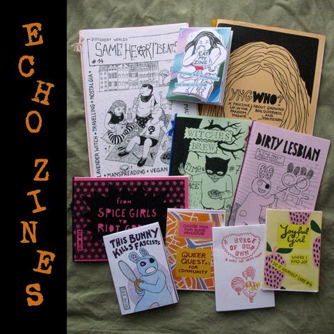 Photo of some of my zines next to each other including zines about antifascist bunnies, lesbophobia, making feminist zines, autonomous spaces, a game for finding queer community, queer music fanzines,, and more.