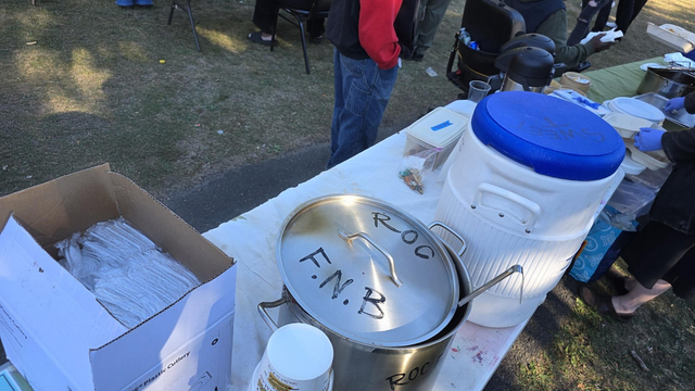 A view of the top of the serving table, with a big ol' pot of chili and a big cooler of drinks. This photo is from the Daniel's Day serve.