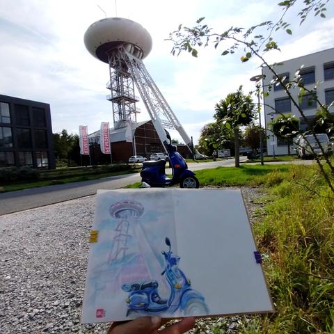 Sketchbook in front of the 'Colani - Egg' and a blue Vespa.