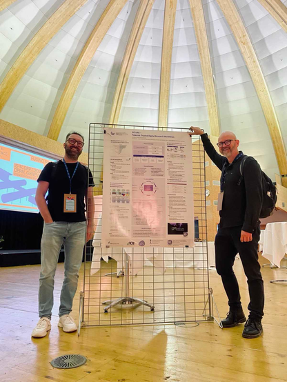 Christian (left) and Felix (right) standing at our poster in the CERN dome.