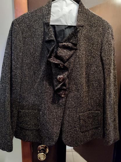 A wool blazer with awesome big metal buttons and bizarre ruffle lapel.