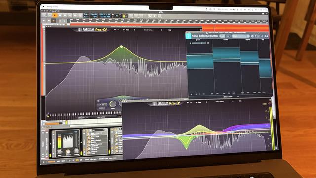 Laptop screen with mastering EQs visible