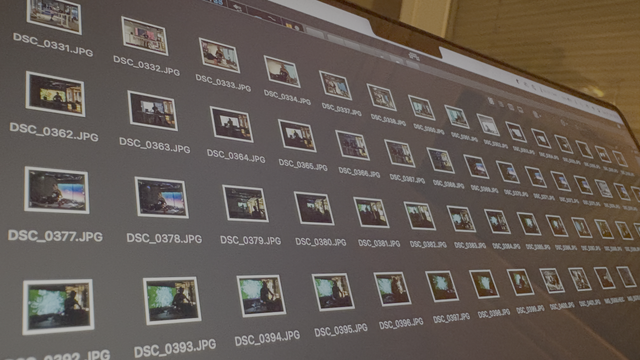 Laptop screen with still images from the live performance visible