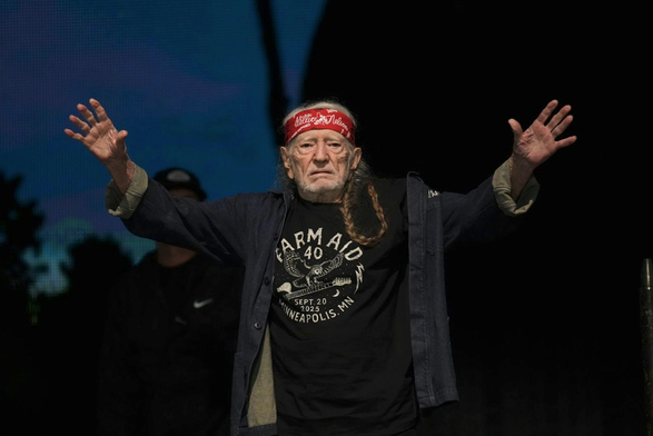 Willie Nelson, wearing a black Farm Aid 40 shirt depicting an owl landing on the neck of a guitar, acknowledges the crowd at the concert.

Willie Nelson takes a bow at Farm Aid 40 in Minneapolis. (Alex Kormann/The Minnesota Star Tribune)