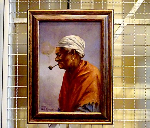 Foto van schilderij met pijprokende vrouw